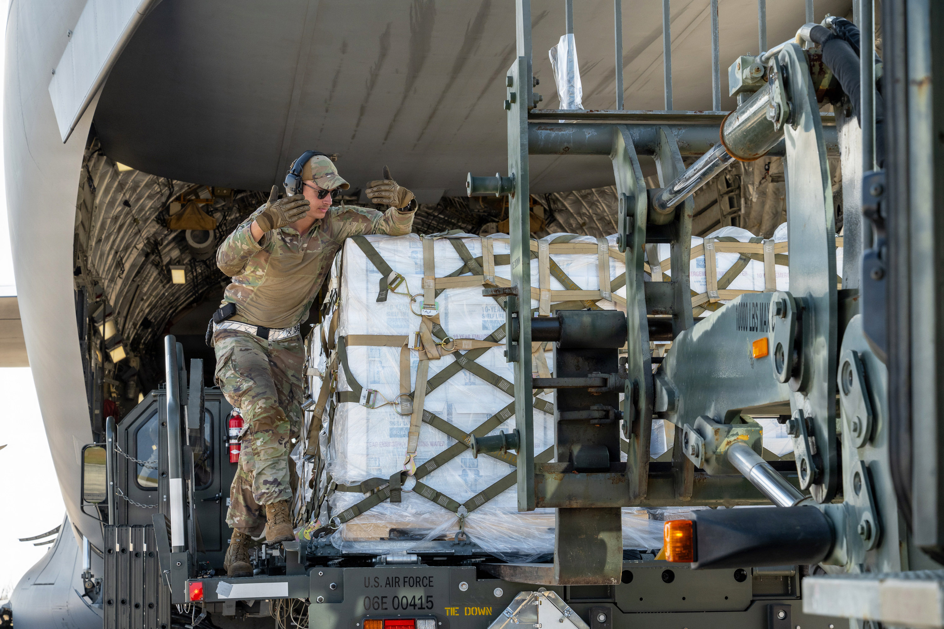 USAF airmen loading strategic air cargo for time-critical supply mission