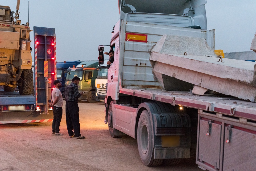 Coalition military supply convoy staging for multi-commodity defense procurement operations