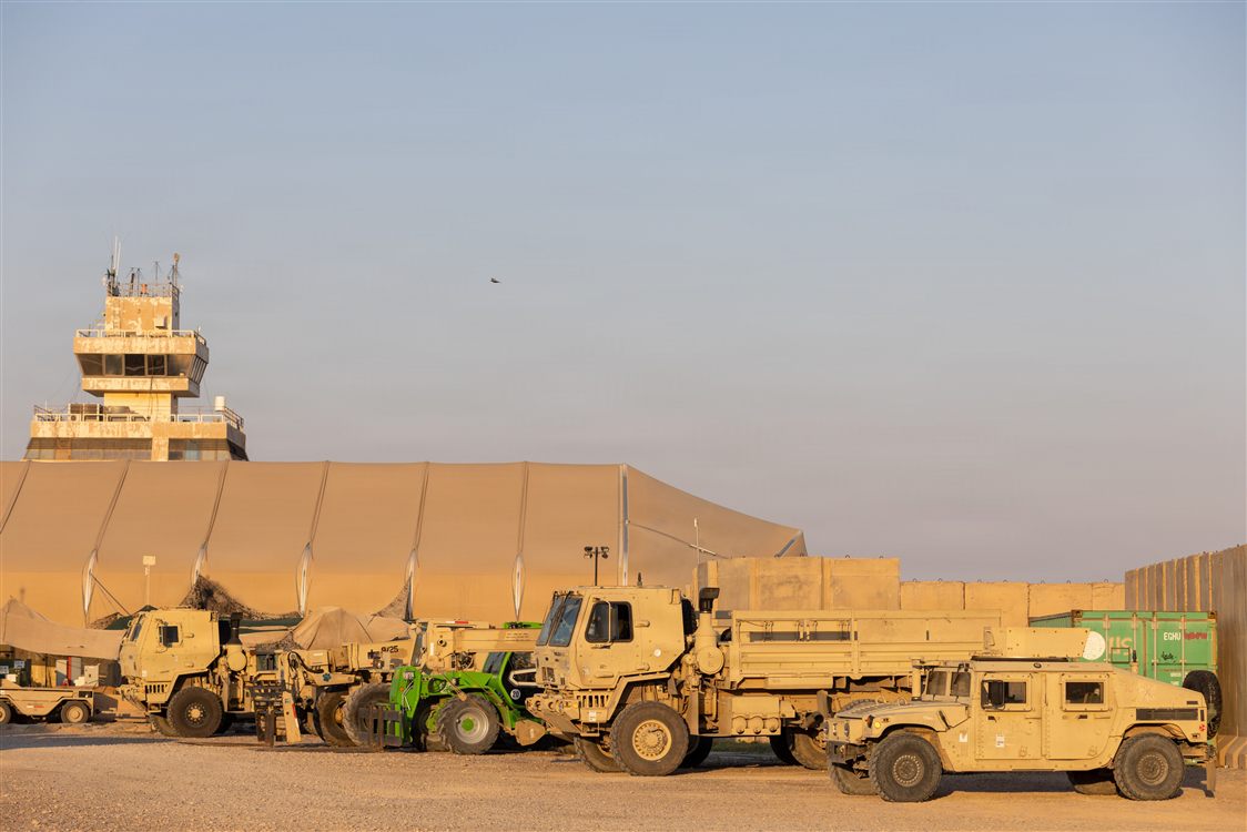 HMMWVs staged at desert airfield for rapid ground deployment