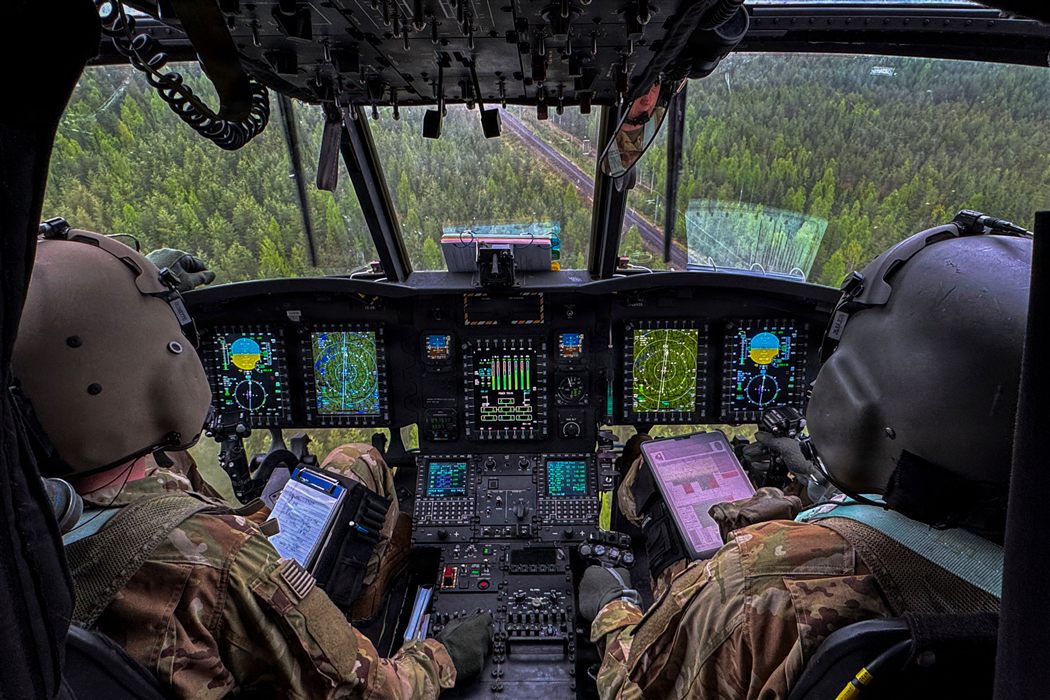 Military helicopter cockpit with advanced tactical avionics and navigation systems