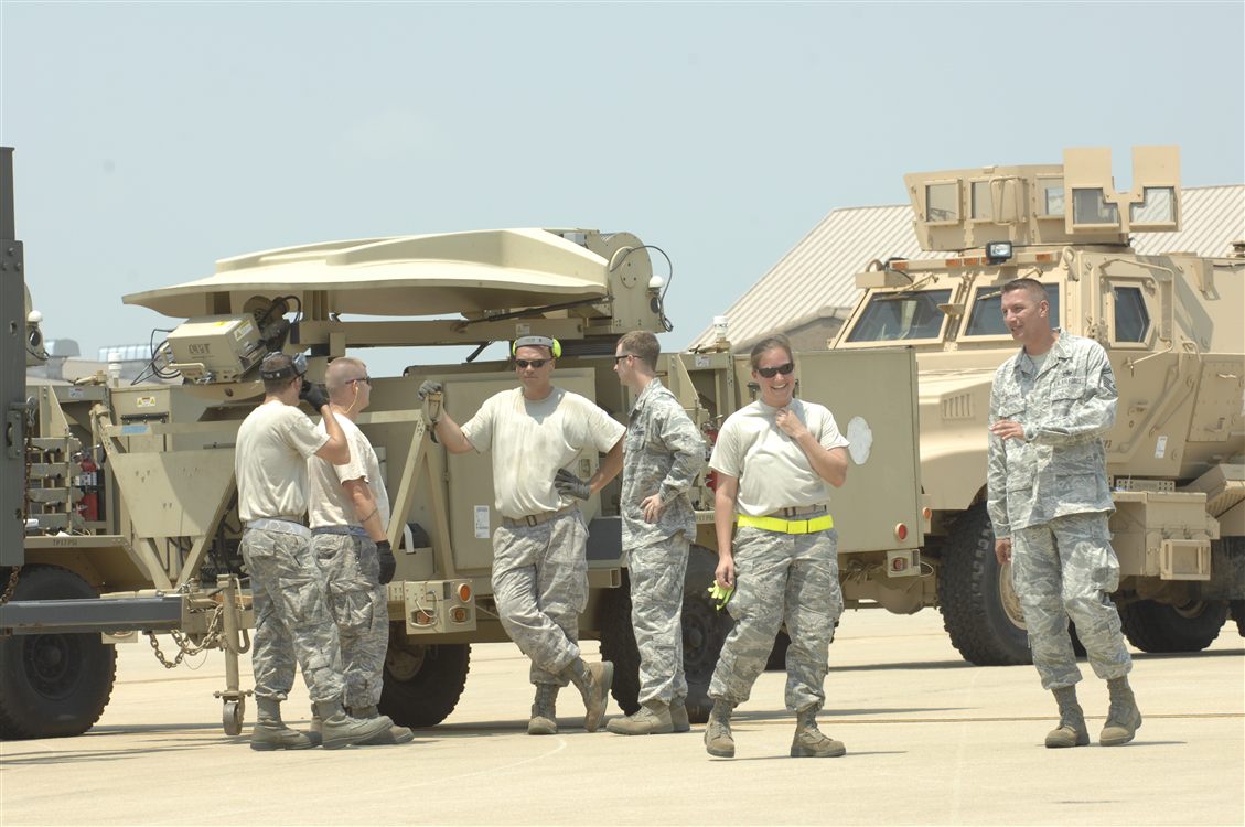 Airmen with MRAP vehicle providing ground force logistics support